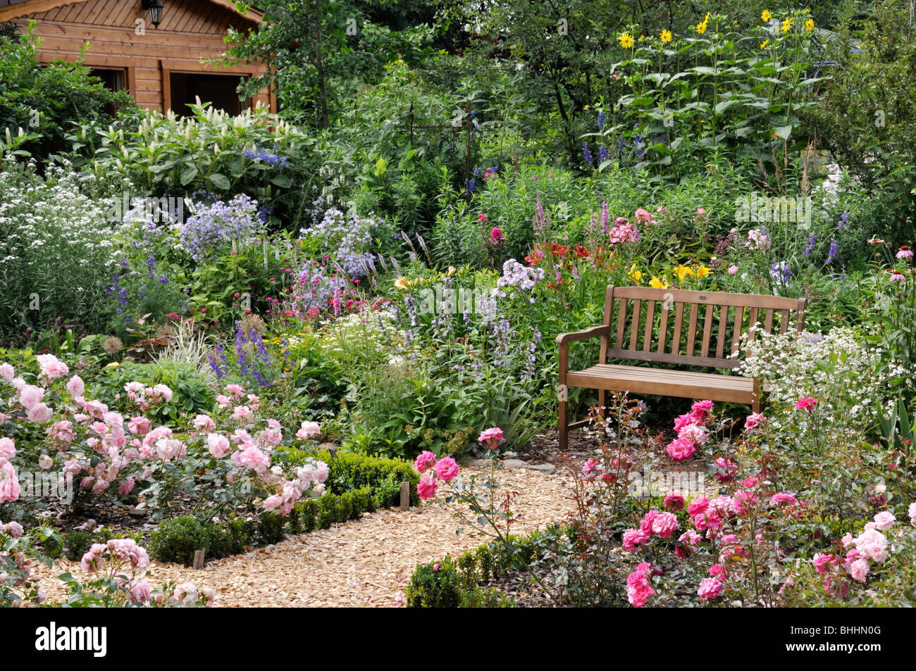 Rose garden with bench. Design: Marianne and Detlef Lüdke Stock Photo