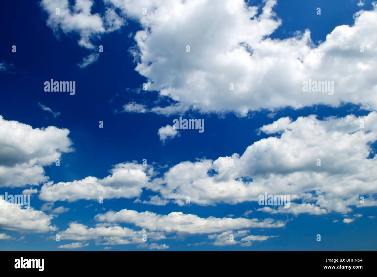 Background of blue sky with white cumulus clouds Stock Photo - Alamy
