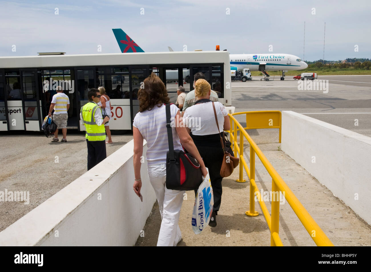 Passengers boarding aircraft at airport on the Greek Mediterranean island of Corfu Greece GR Stock Photo