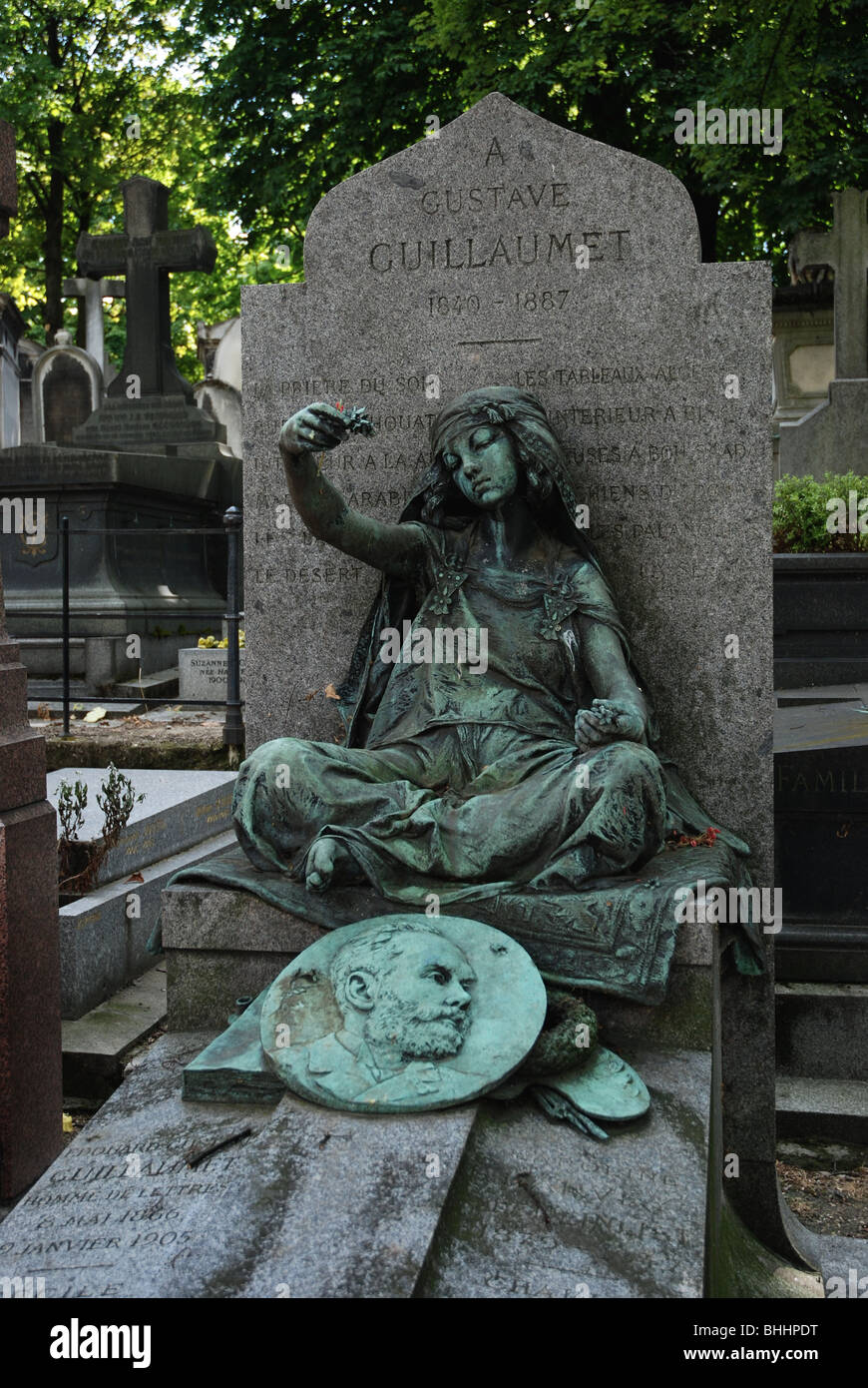Grave of Gustave Guillaumet (1840-87), orientalist painter, in Montmartre Cemetery Paris features a young girl by the sculptor Louis-Ernest Barrias. Stock Photo