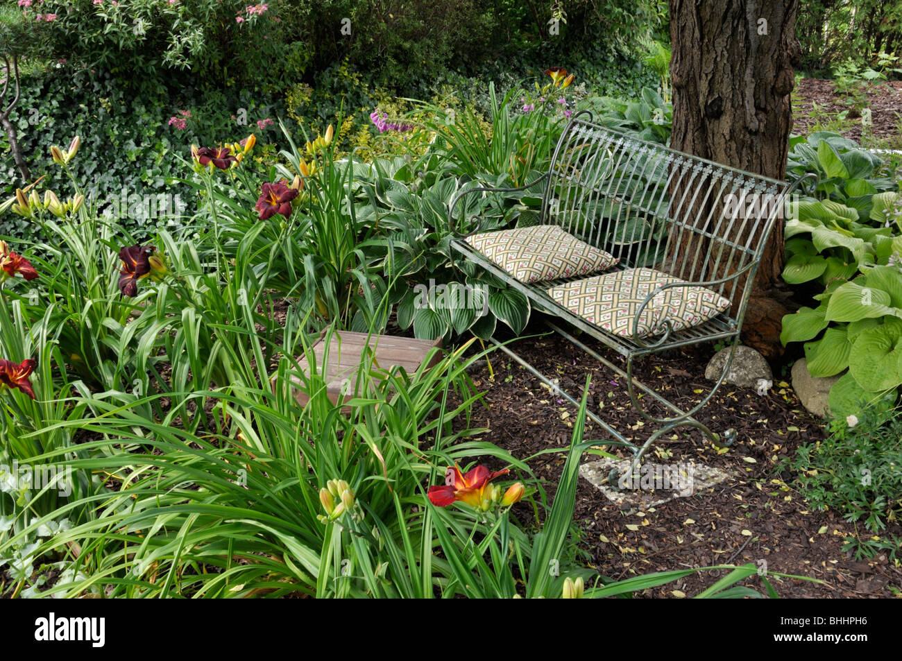 Bench in a perennial garden. Design: Marianne and Detlef Lüdke Stock Photo