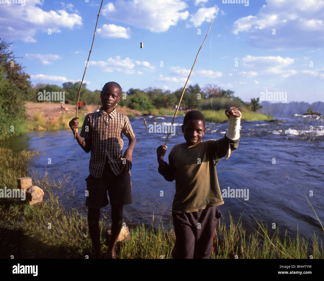 Boys fishing, Victoria Falls, Livingstone, Southern Province, Republic of Zambia Stock Photo
