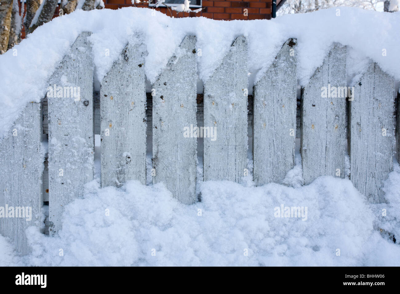 white picket fence in snow Stock Photo
