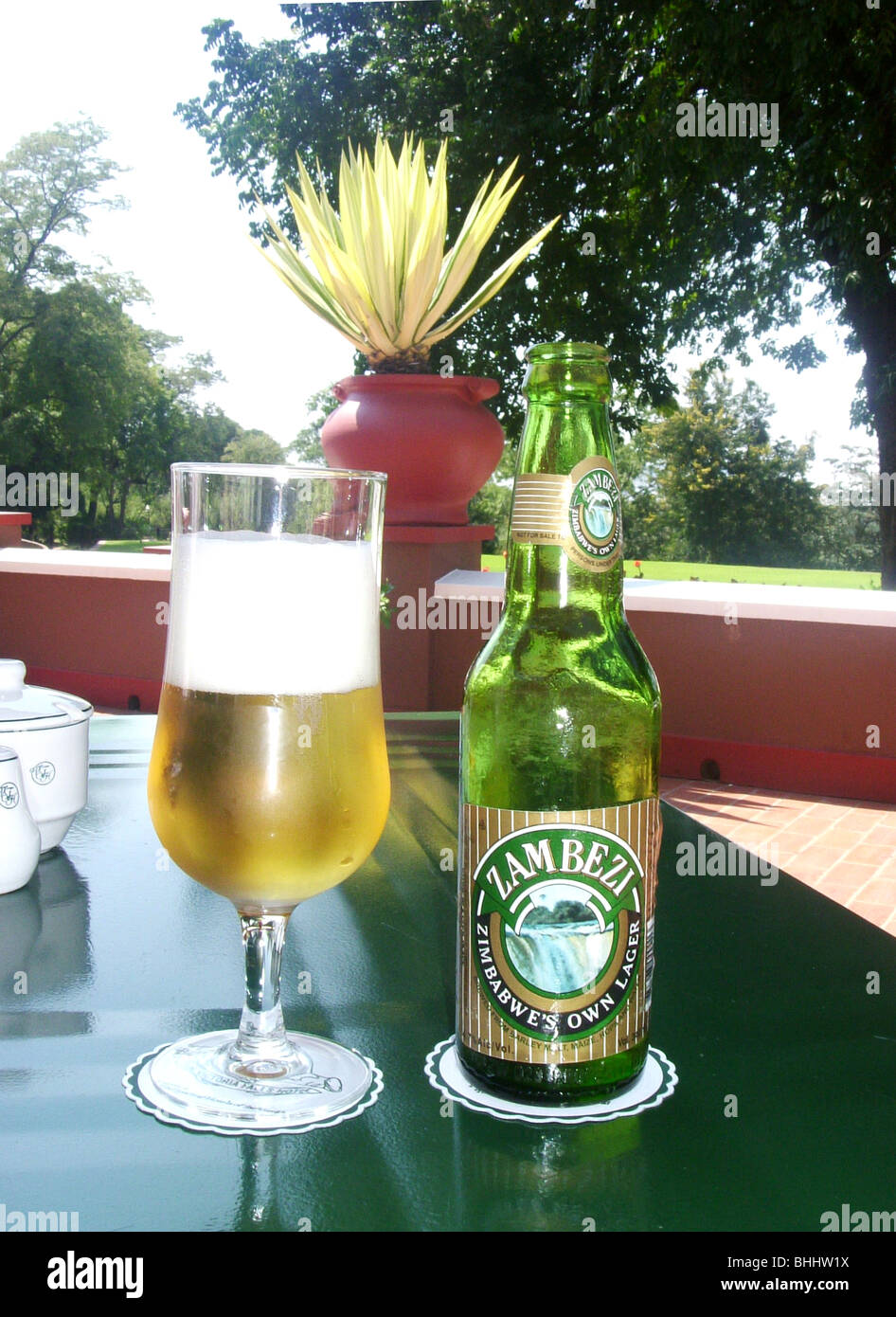 Bottle of local Zambezi Beer on terrace, Victoria Falls Hotel, Victoria Falls, Matabeleland North Province, Republic of Zimbabwe Stock Photo
