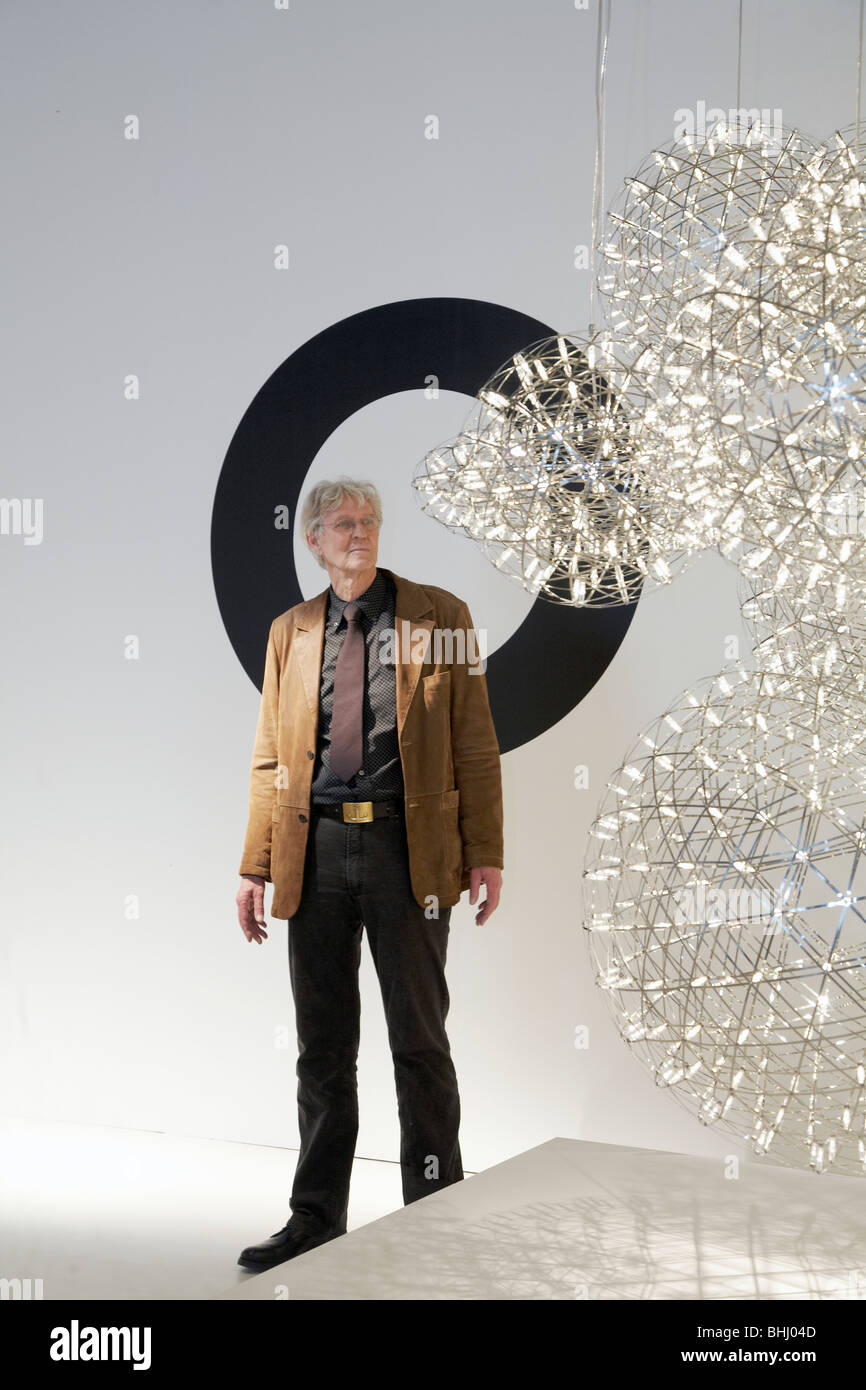 portrait of Raimond Puts facing one of his lights creation during Salone del Mobile 2009, Milano, Italy Stock Photo