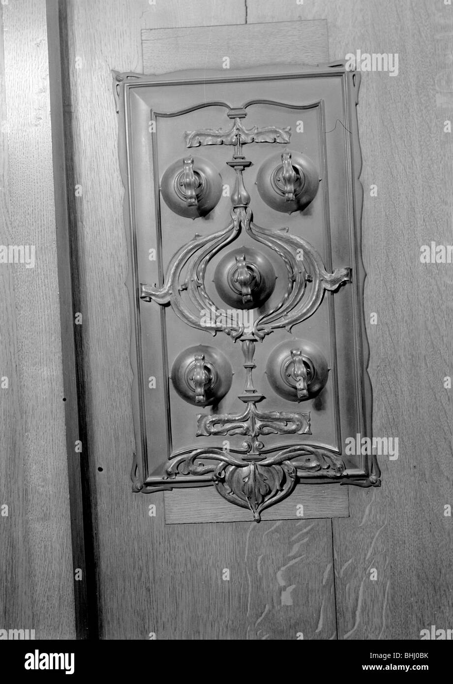 A bronze switch plate in the John Rylands Library, University of Manchester, 1942.   Artist: GB Wood Stock Photo