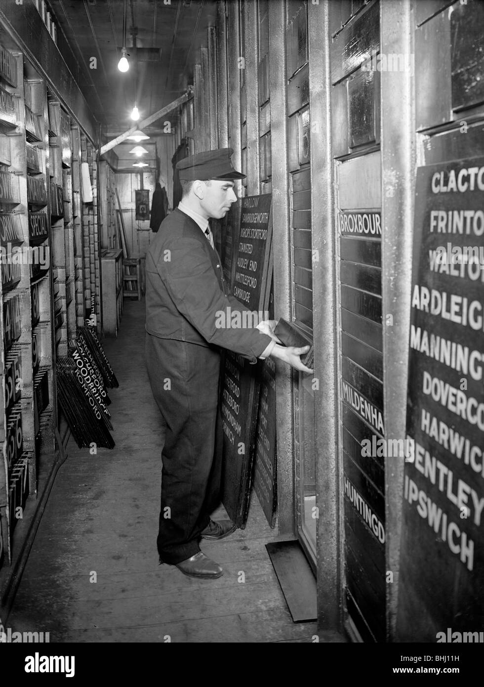 Member of staff changing departure information, Liverpool Street Station, London, 1950. Artist: Unknown Stock Photo