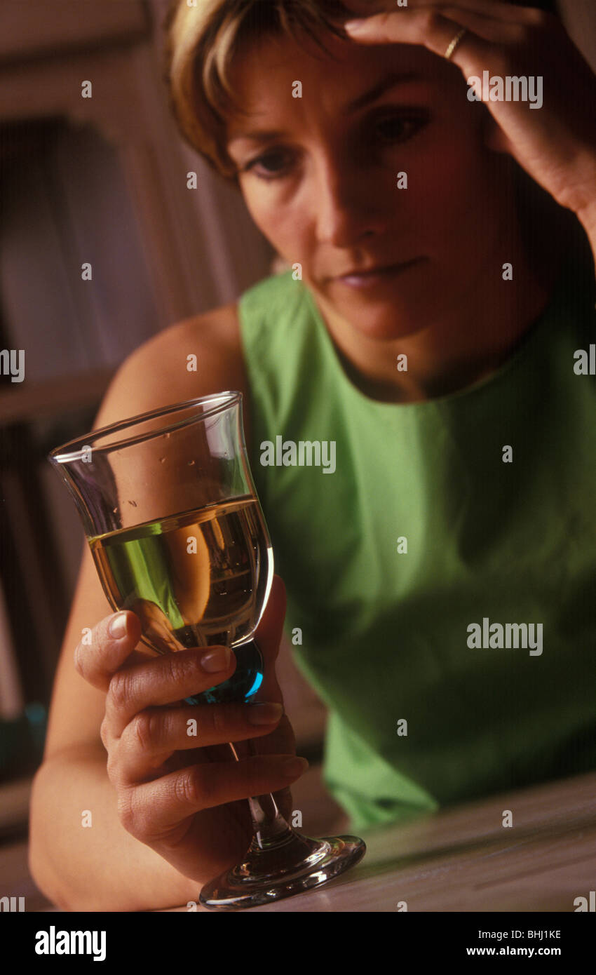 Woman drinking glass of wine Stock Photo