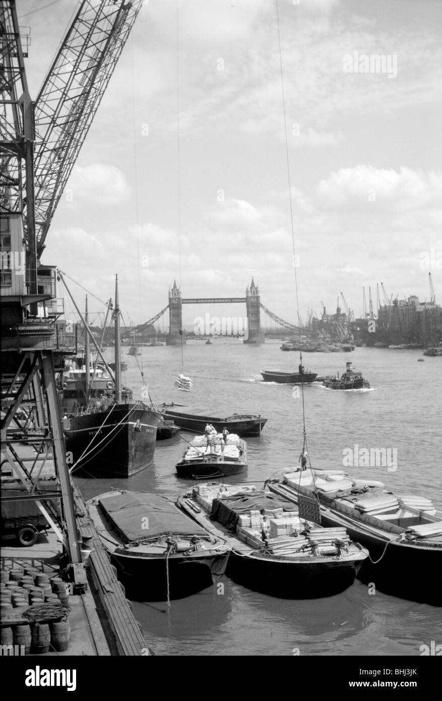 Tower Bridge with shipping in the Pool of London and vessels at Hay's Wharf, Southwark, c1945-c1965. Artist: SW Rawlings Stock Photo