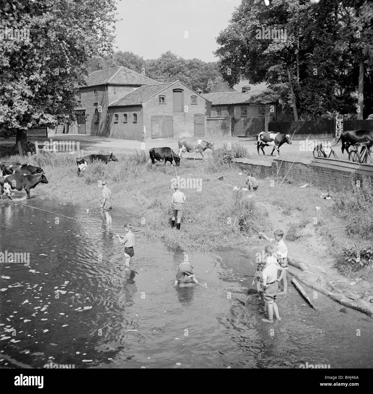 Boy fishing near river in hi-res stock photography and images - Alamy