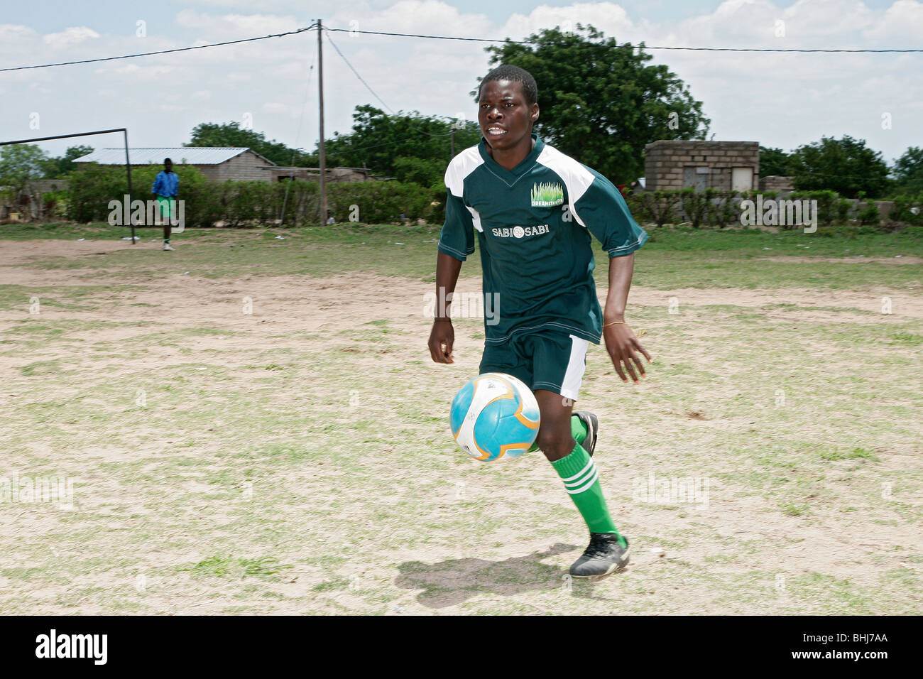 Black African boys playing football in Huntington village in South African Stock Photo