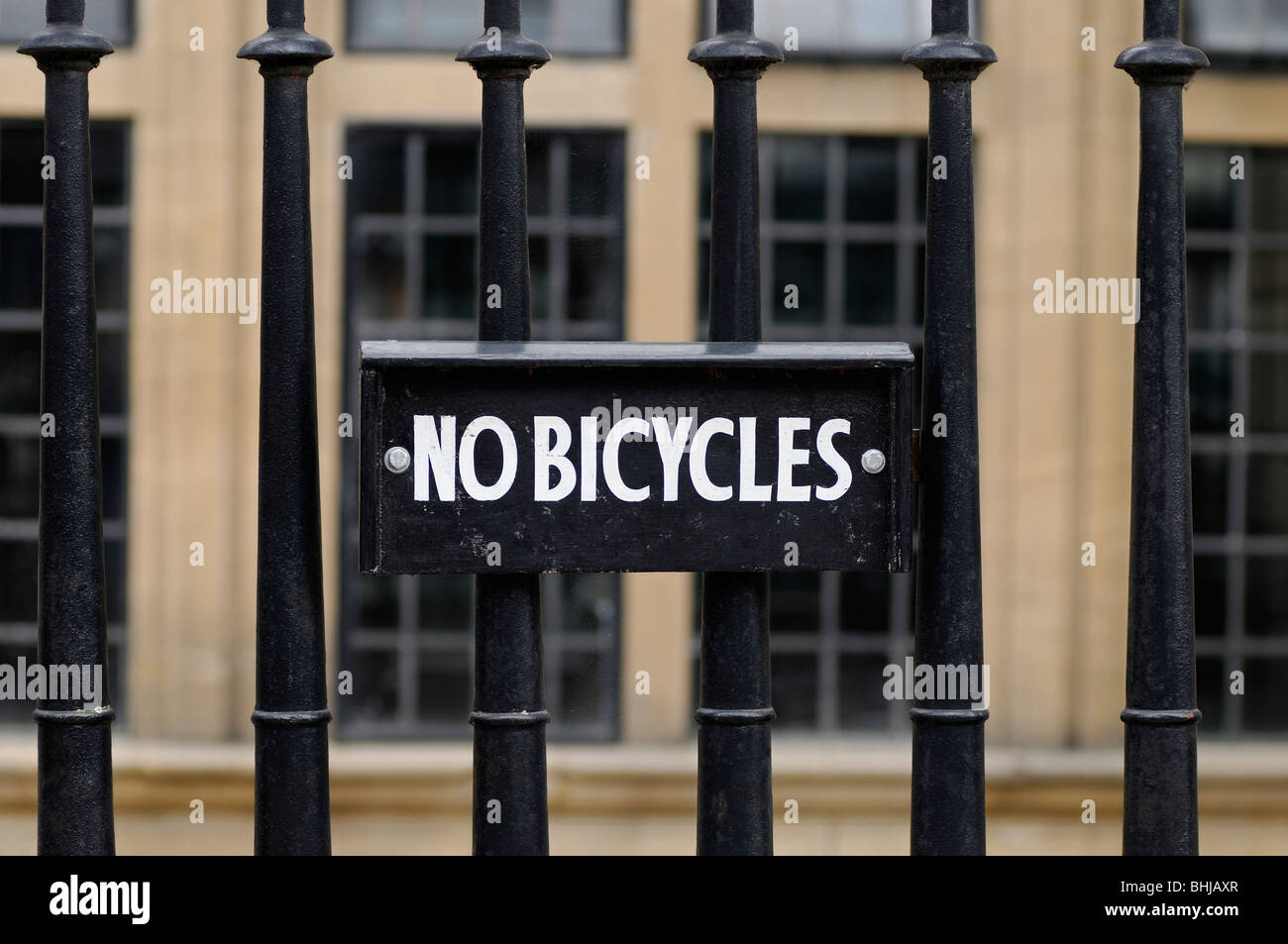 No Bicycles Sign on Railings Outside a University Building, Oxford, United Kingdom. Stock Photo