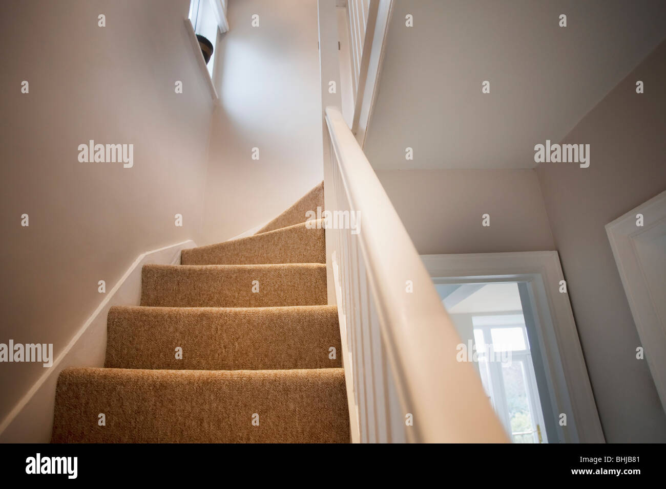 stairs and stair carpet inside a newly modernised house Stock Photo