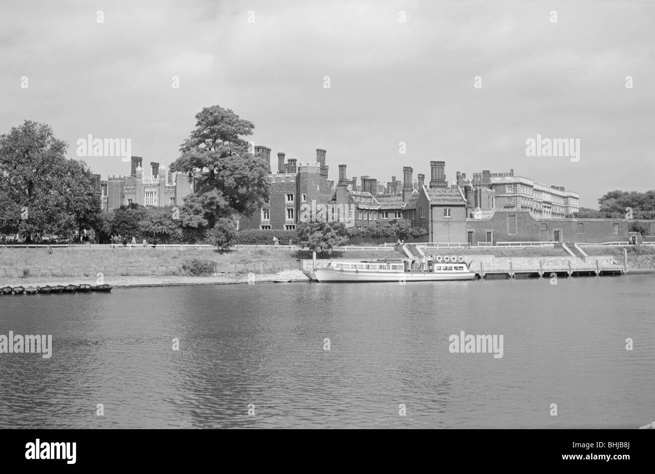 Hampton Court Palace, viewed from the south bank of the River Thames ...