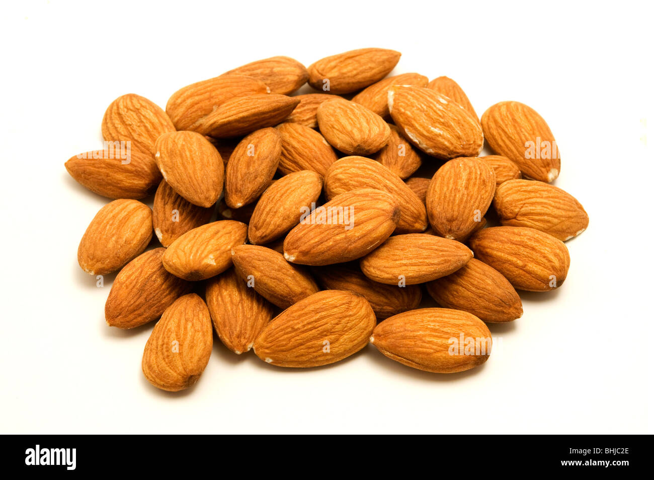 Unshelled almonds on a white background Stock Photo