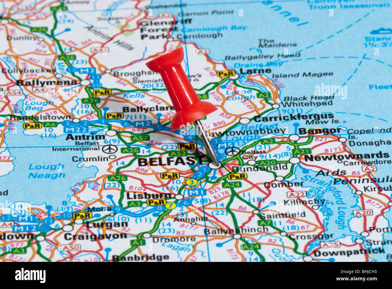 red map pin in road map pointing to city of Belfast Stock Photo