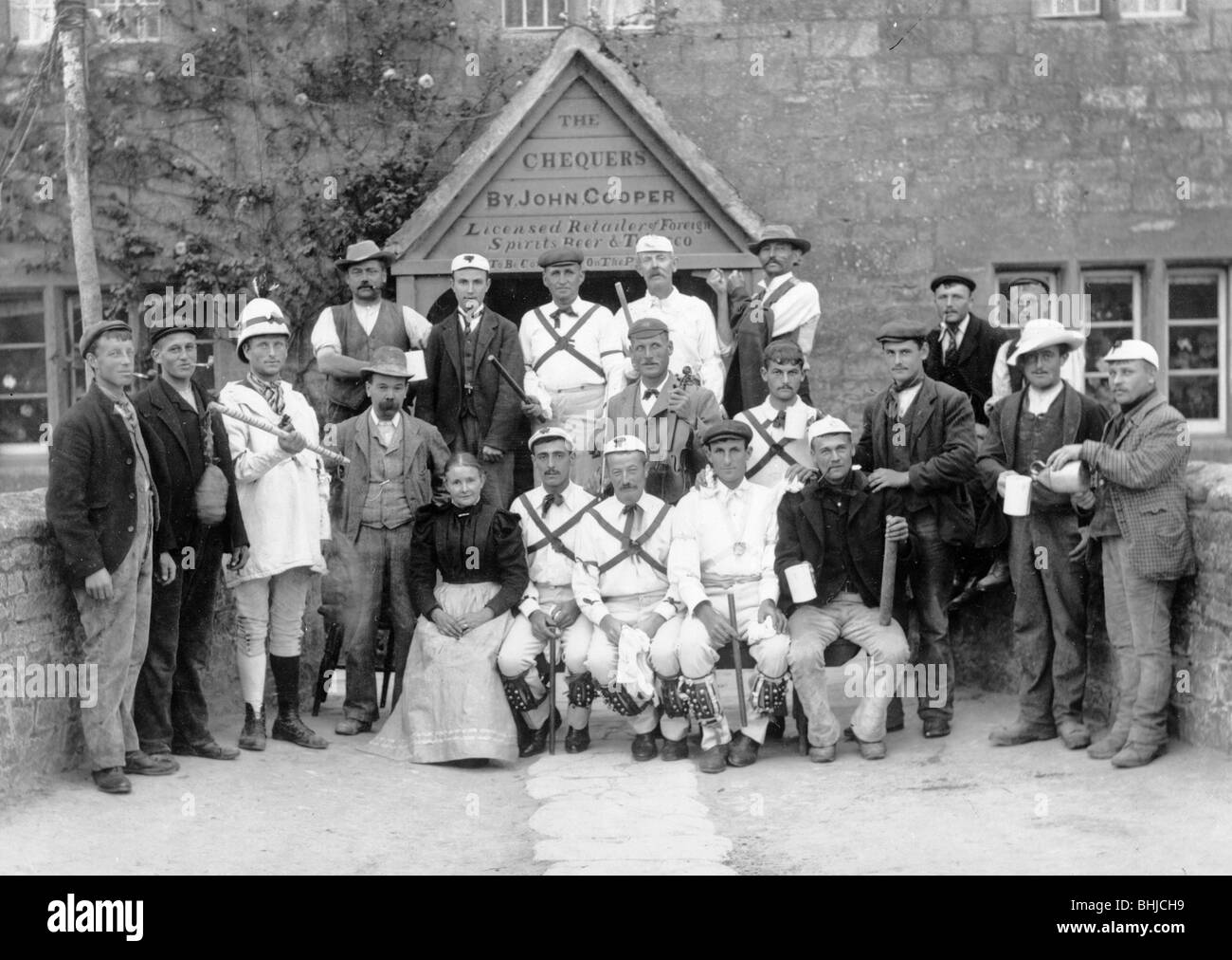 The Headington Quarry Morris Dancers outside the Chequers, Oxford, Oxfordshire, c1860-c1922. Artist: Henry Taunt Stock Photo