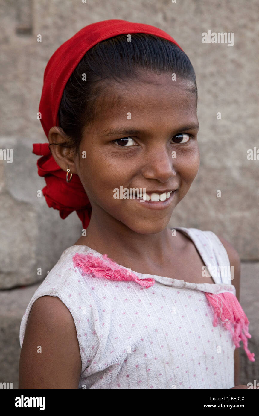 Smiling Indian Girl on banks of River Ganges, Varanasi, India Stock Photo