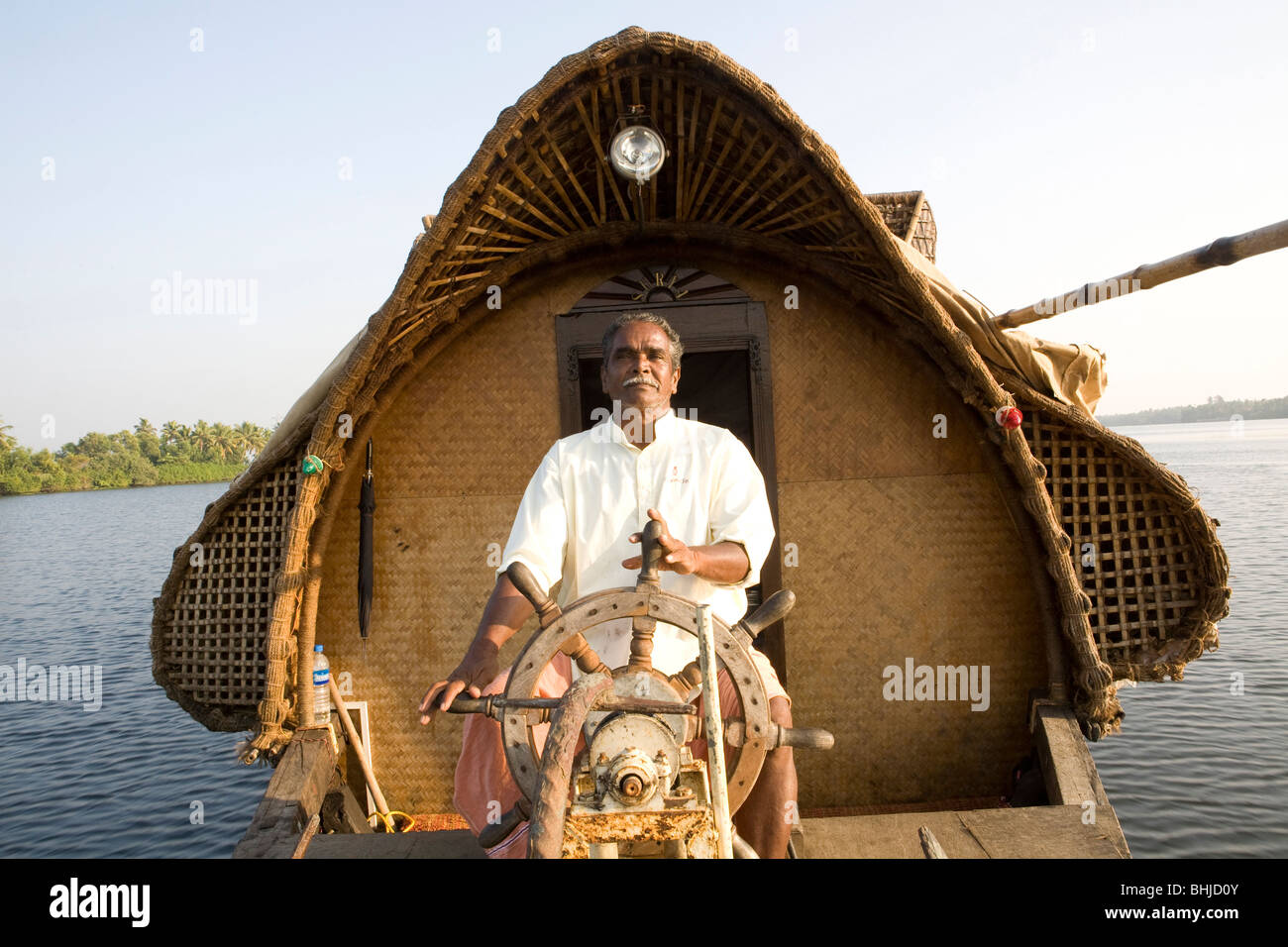 Kerala southern india backwater houseboat trip captain Stock Photo