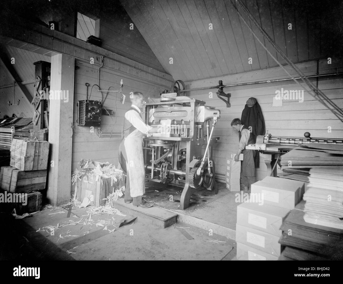 A man operates a printing press at the Church Army Press, Oxford