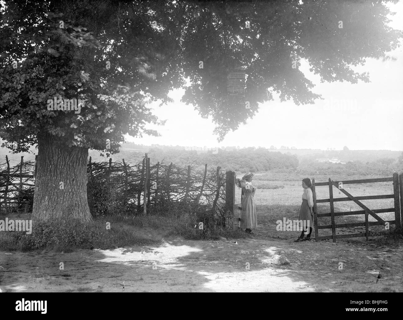 Two women at a gate, Open Brasnose, Horspath, Oxfordshire, c1860-c1922. Artist: Henry Taunt Stock Photo