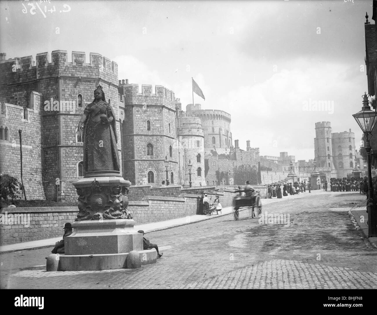 Windsor Castle from Pedscoe Street with a statue of Queen Victoria, Windsor, Berkshire, c1860-c1922. Artist: Henry Taunt Stock Photo