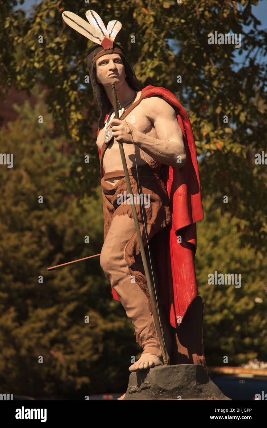 A life size and coloured statue of a Native American Indian in Mount