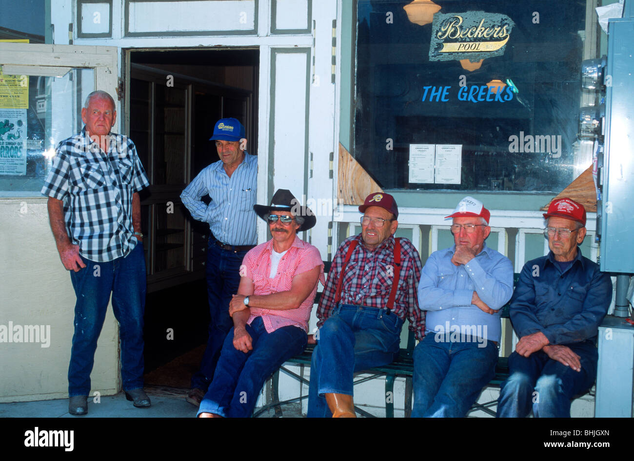 Local men sitting in front of small town bar or saloon in Ferndale, California Stock Photo