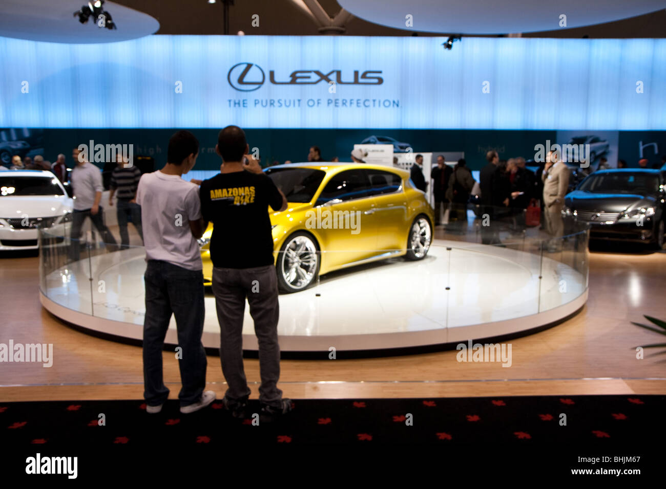 Consumers taking picture of the new concept car a gold Lexus LF-Ch at the 2010 Canadian International AutoShow (CIAS) Stock Photo