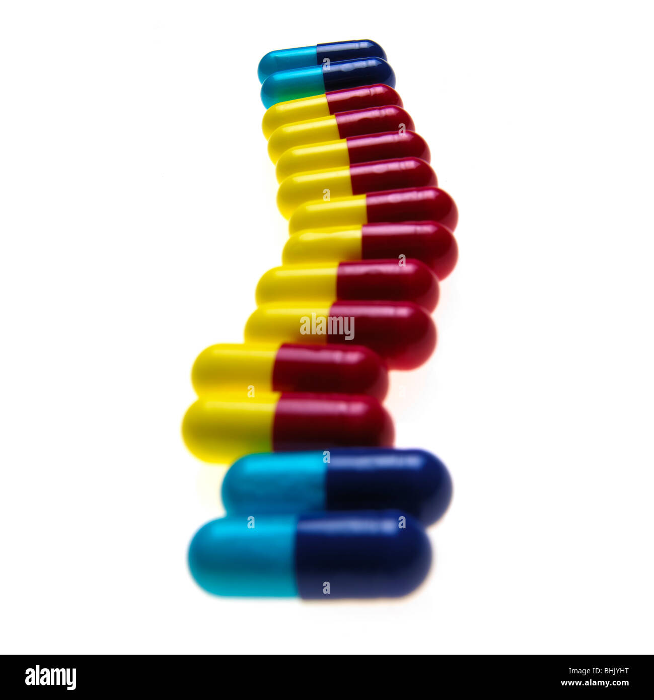 blue, red and yellow flu capsules on a white background Stock Photo