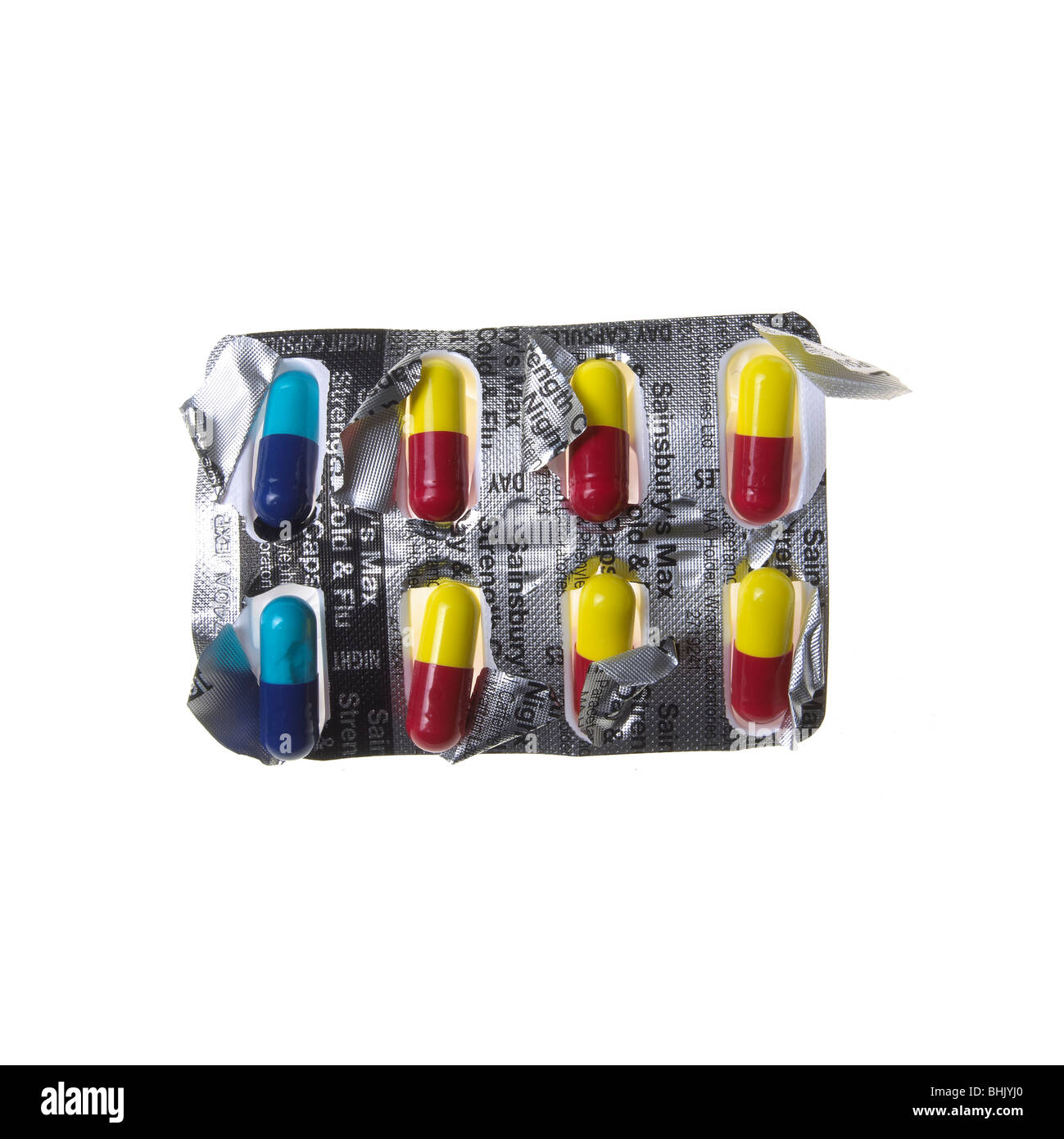 blue, red and yellow flu capsules on a white background Stock Photo