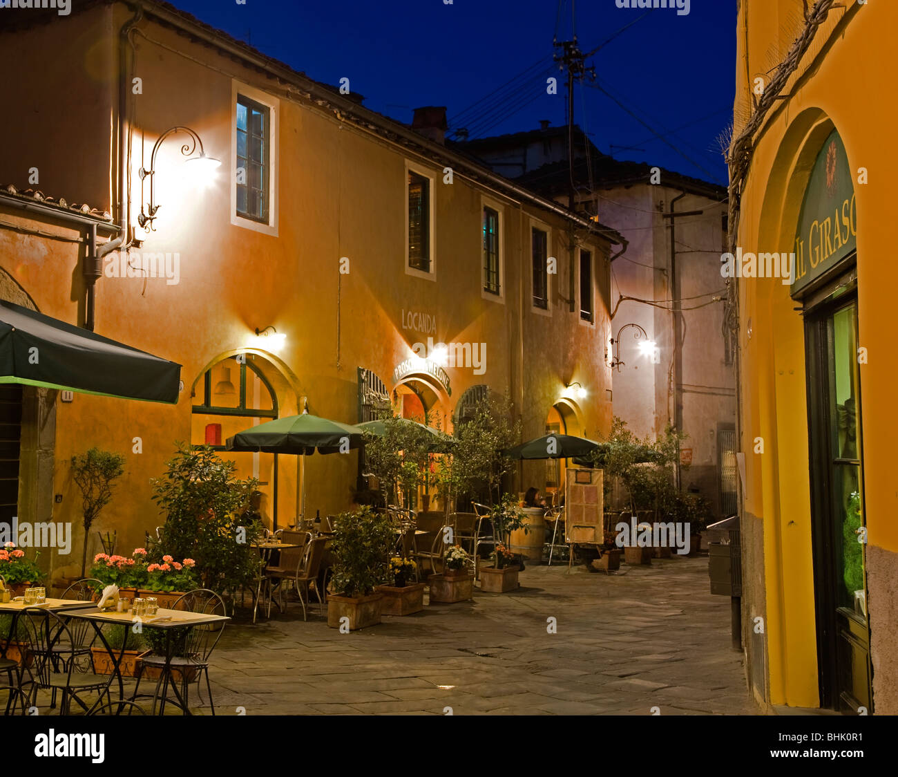 Italy, Tuscany, Lucca Cafe at twilight near Piazza Anfiteatro Stock Photo