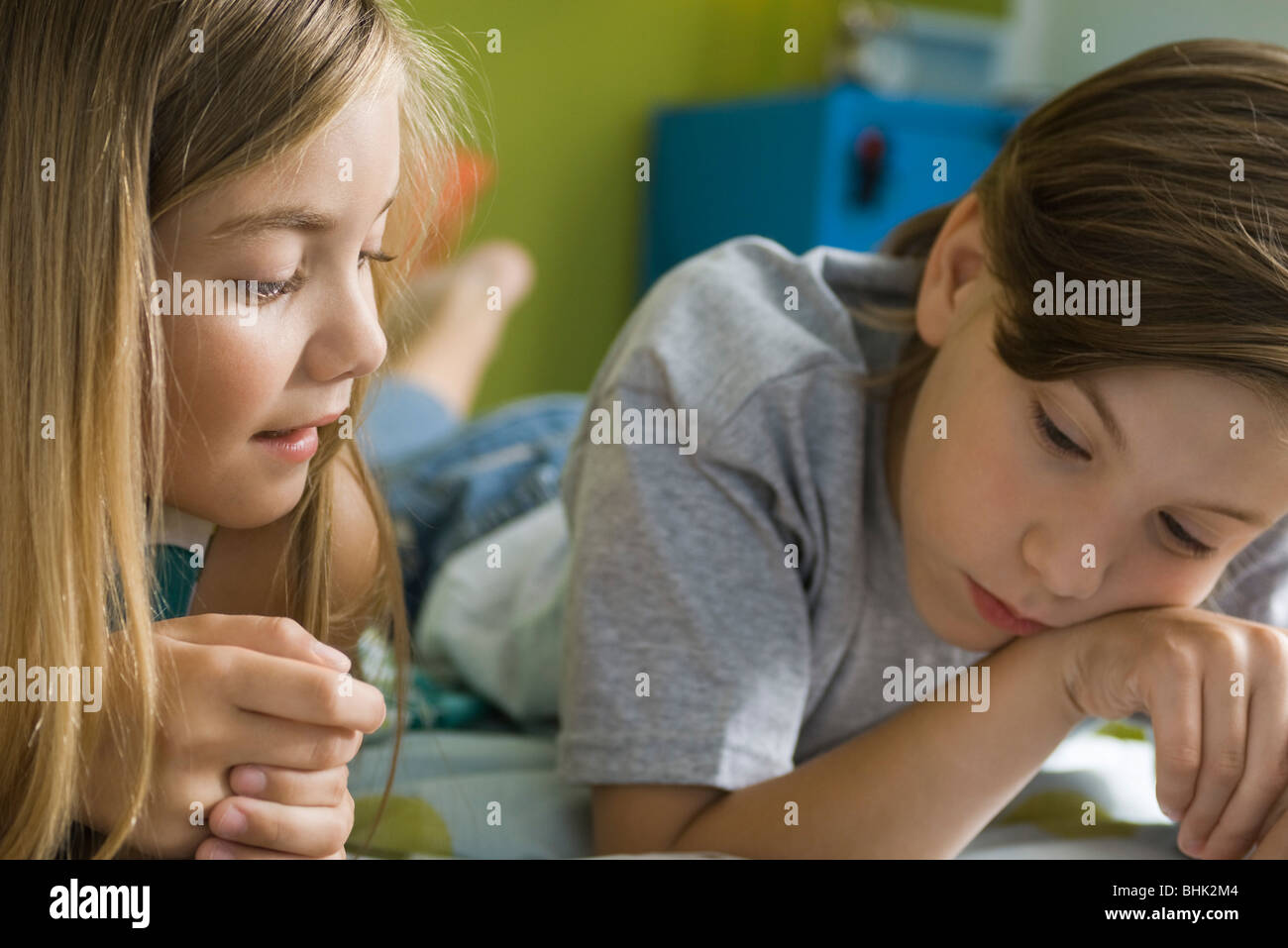 Preteen girl lying on stomach hi-res stock photography and images - Alamy