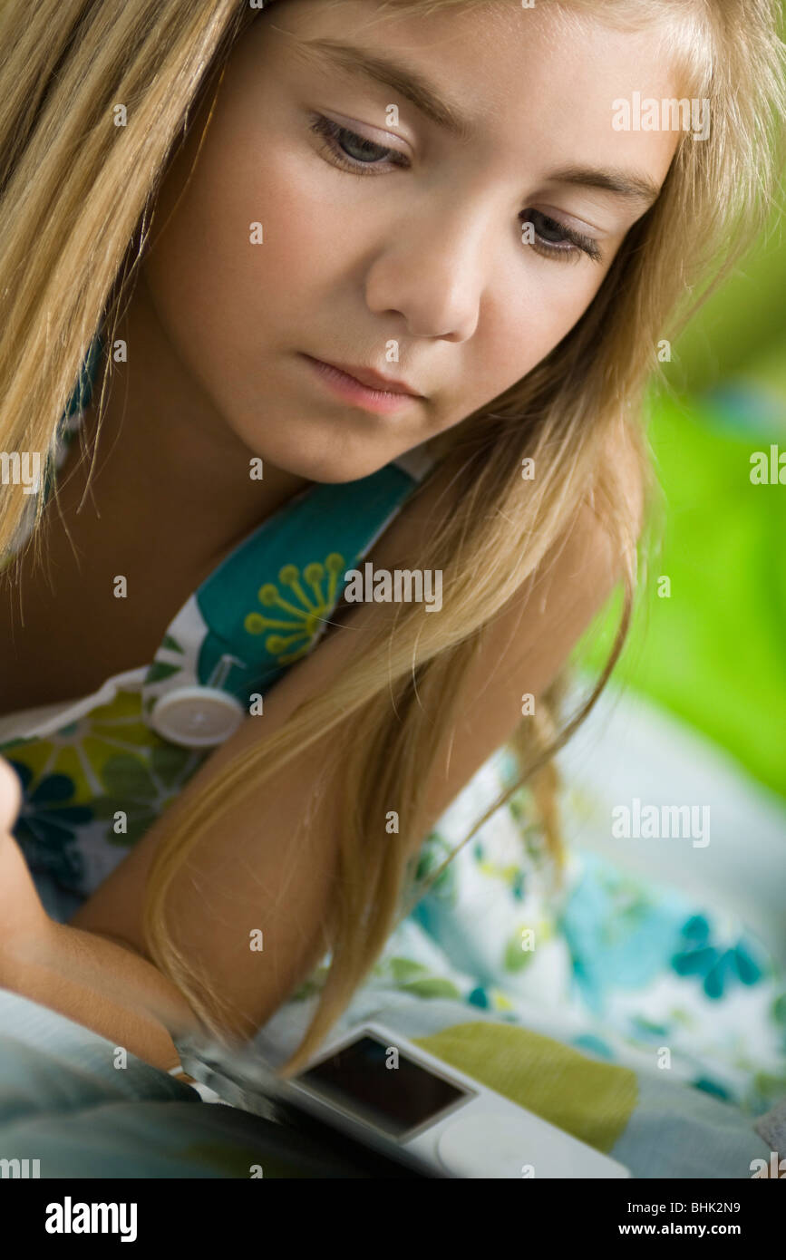 Preteen girl lying on stomach hi-res stock photography and images - Alamy