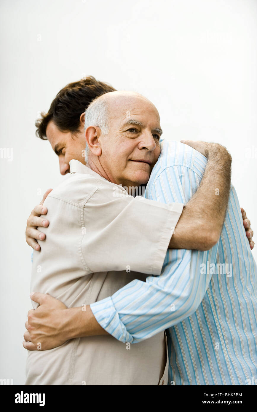 Senior man embracing adult son Stock Photo: 28079288 - Alamy