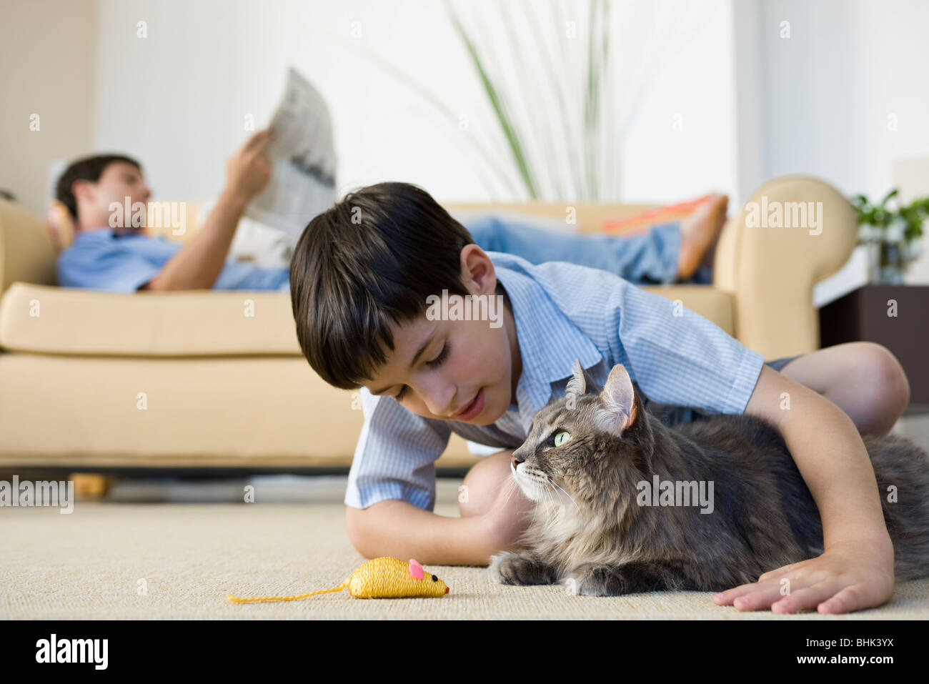 Young boy with pet cat Stock Photo
