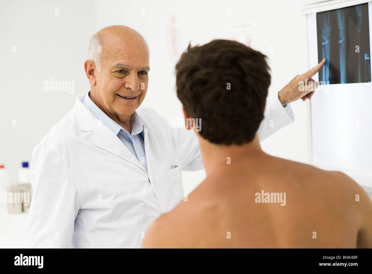Doctor explaining x-ray to patient Stock Photo