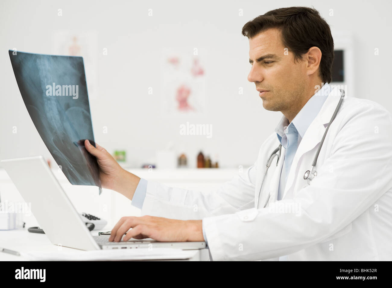 Doctor studying x-ray Stock Photo