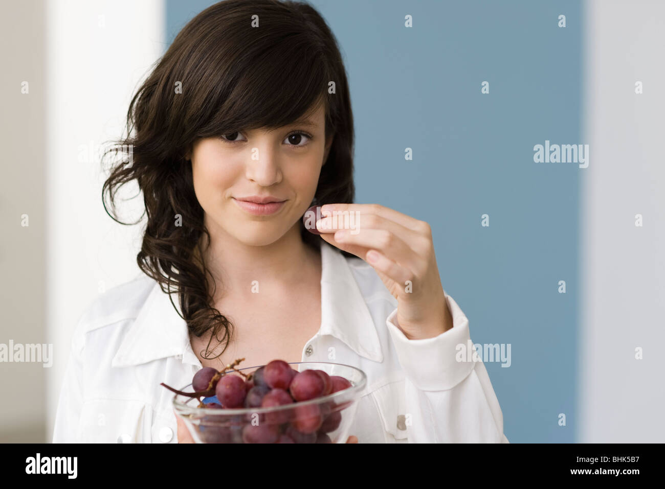 Teenage girl eating grapes Stock Photo