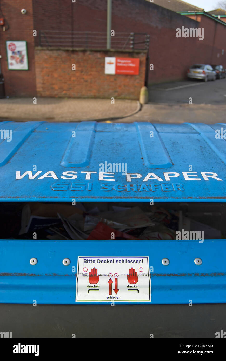 detail of a waste paper recycling bin in shepperton, middlesex, england, with instructions in german Stock Photo
