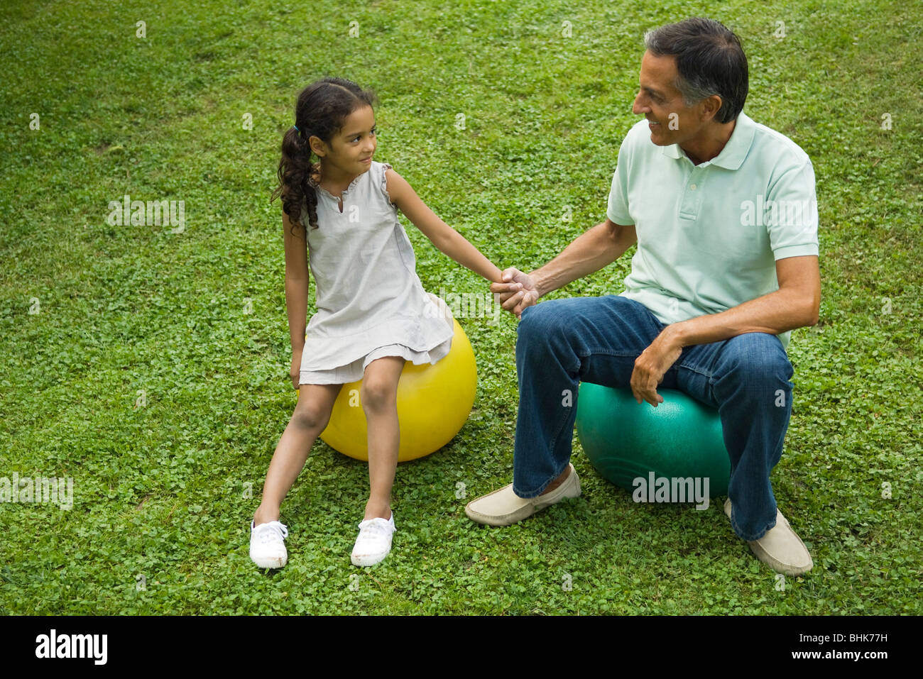 Father and daughter together in park Stock Photo - Alamy
