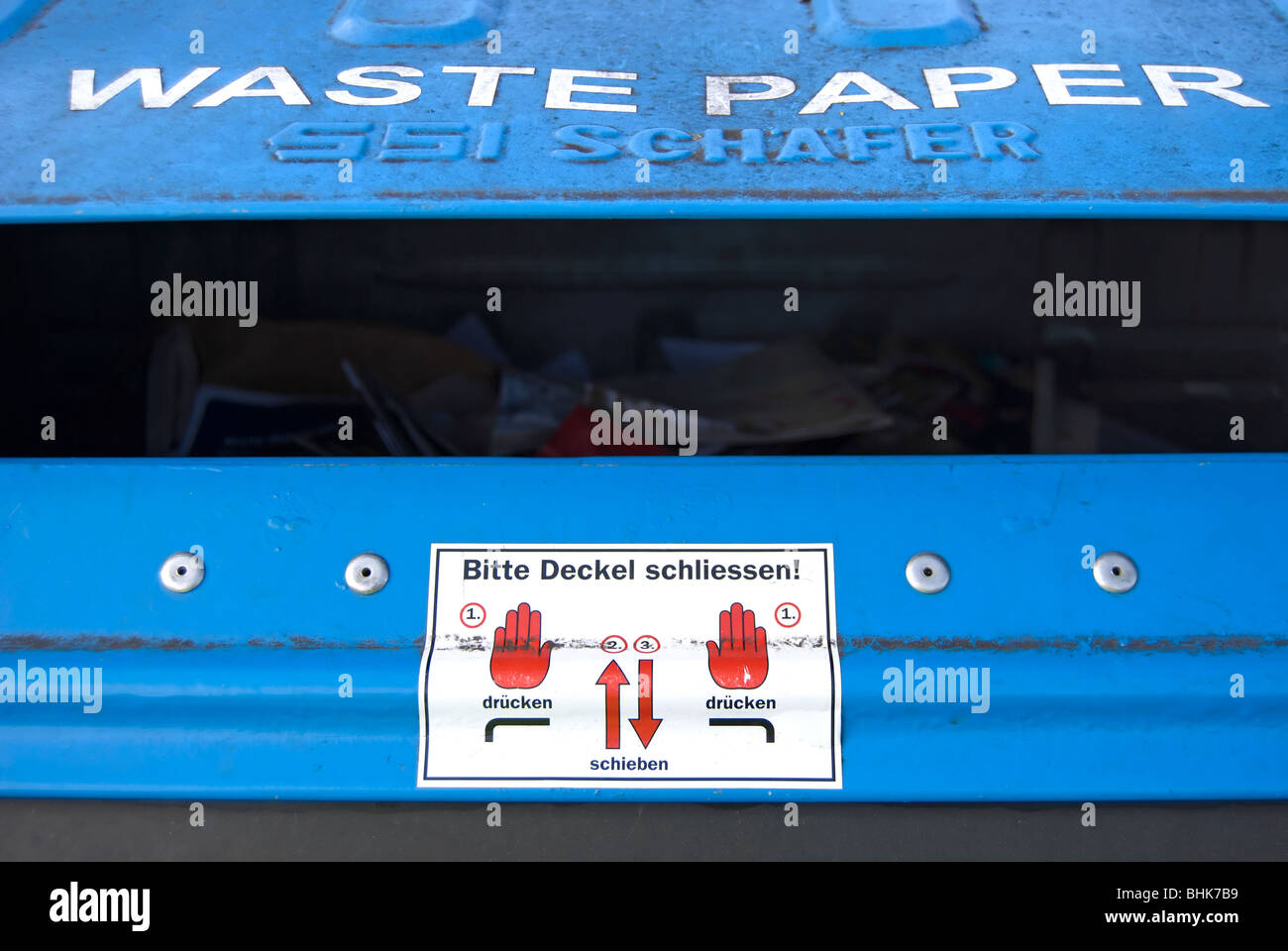 detail of a waste paper recycling bin in shepperton, middlesex, england, with instructions in german Stock Photo