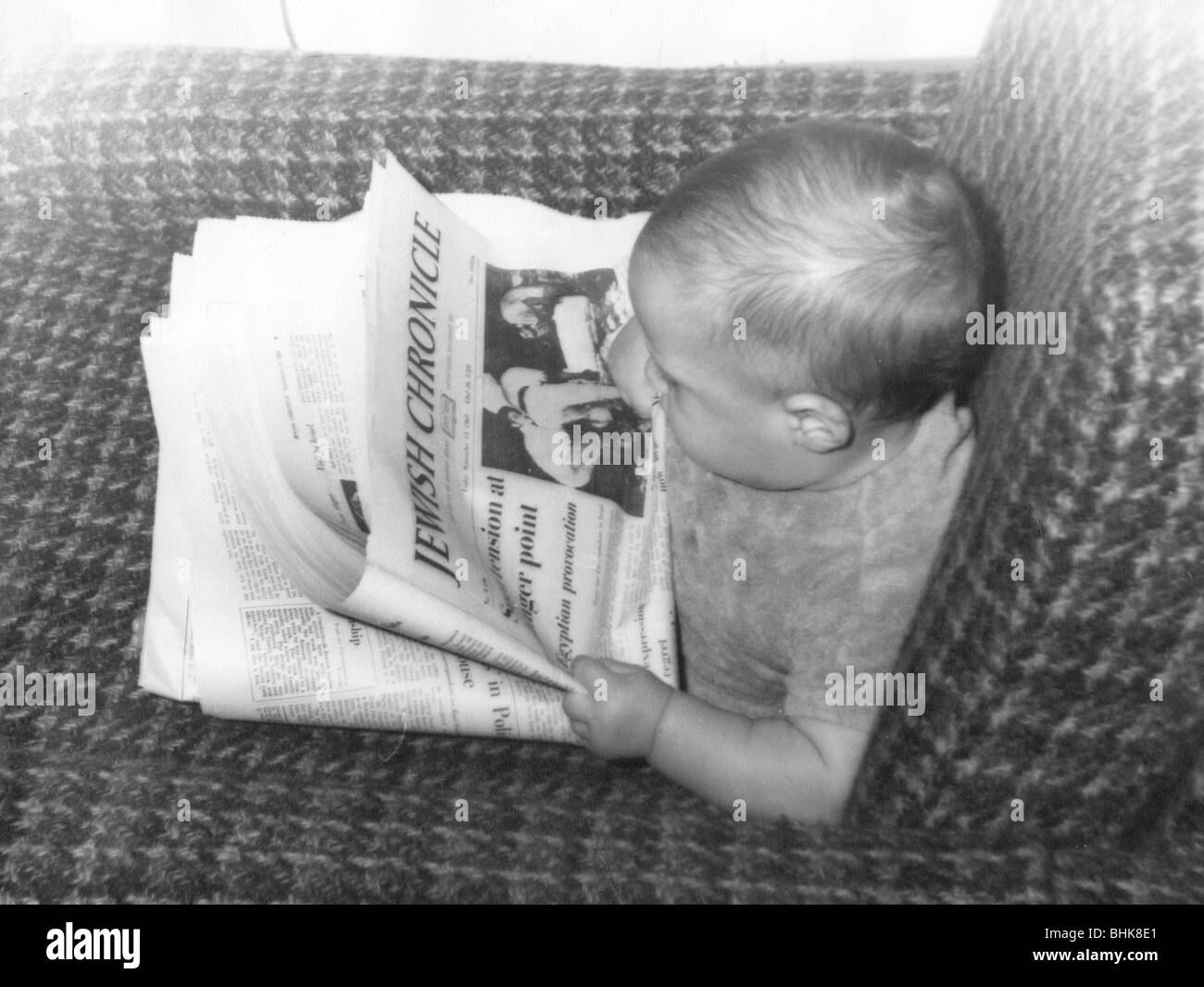 Baby Alex Feldman reading the Jewish Chronicle, 1968. Artist: Unknown Stock Photo