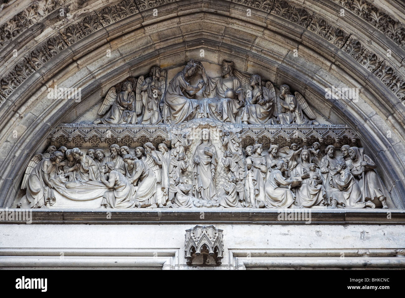 Religious stone carvings on Ypres Cathedral Belgium Europe Stock Photo