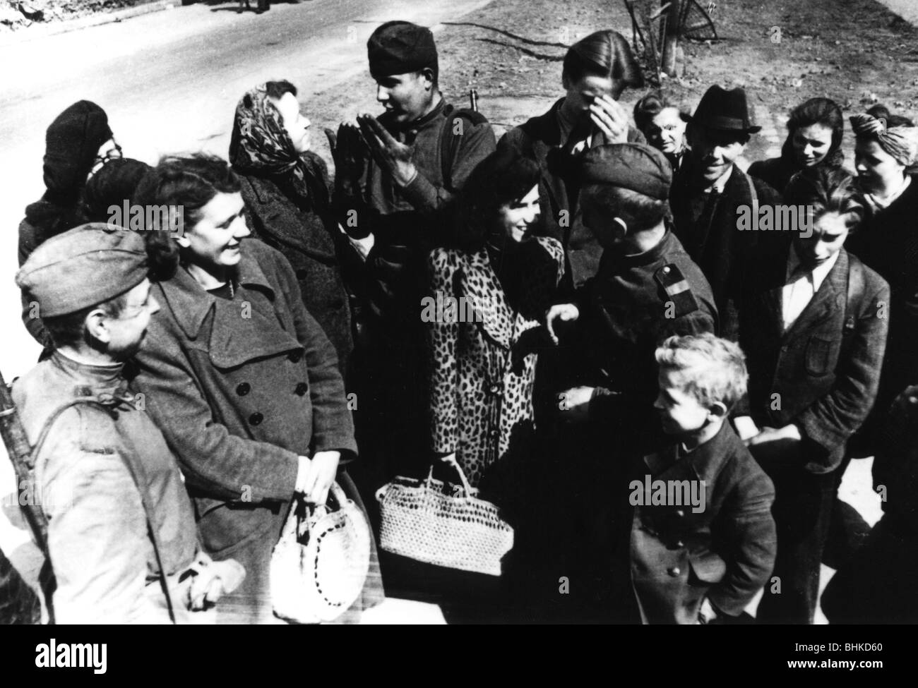 events, Second World War / WWII, Russia 1945 / 1945, Red Army soldiers talking to civilians, probably 1945, end of war, victors, victory, 20th century, historic, historical, Soviet Union, conversation, smiling, occupation, USSR, occupying force, women, children, kids, people, 1940s, Stock Photo