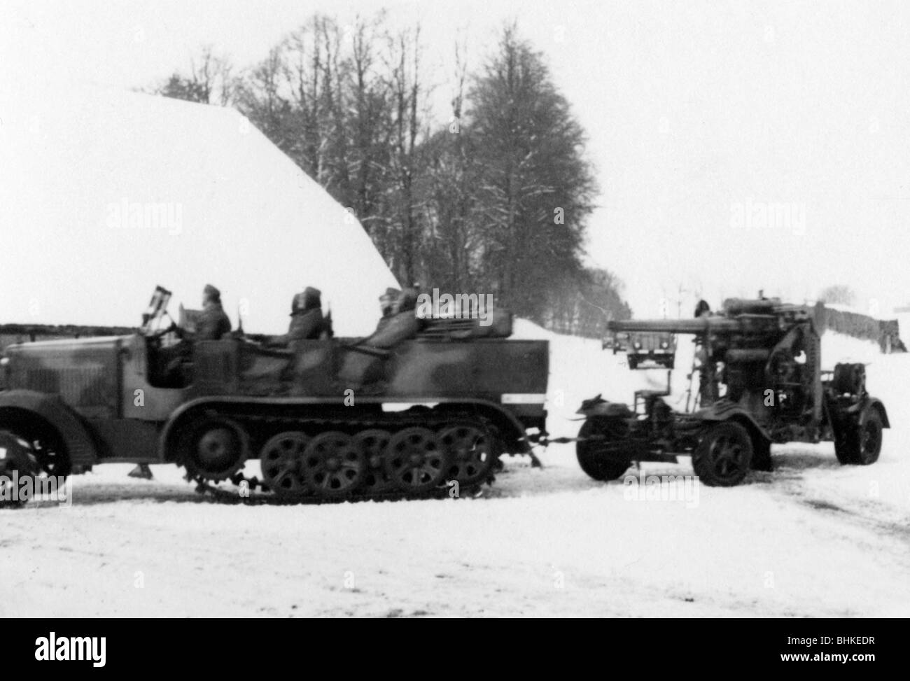 Nazism / National Socialism, military, Wehrmacht, Luftwaffe, anti-aircraft battery during training in the winter, half-track tractor with 88 mm AA gun Flak 18, 1930s, Stock Photo