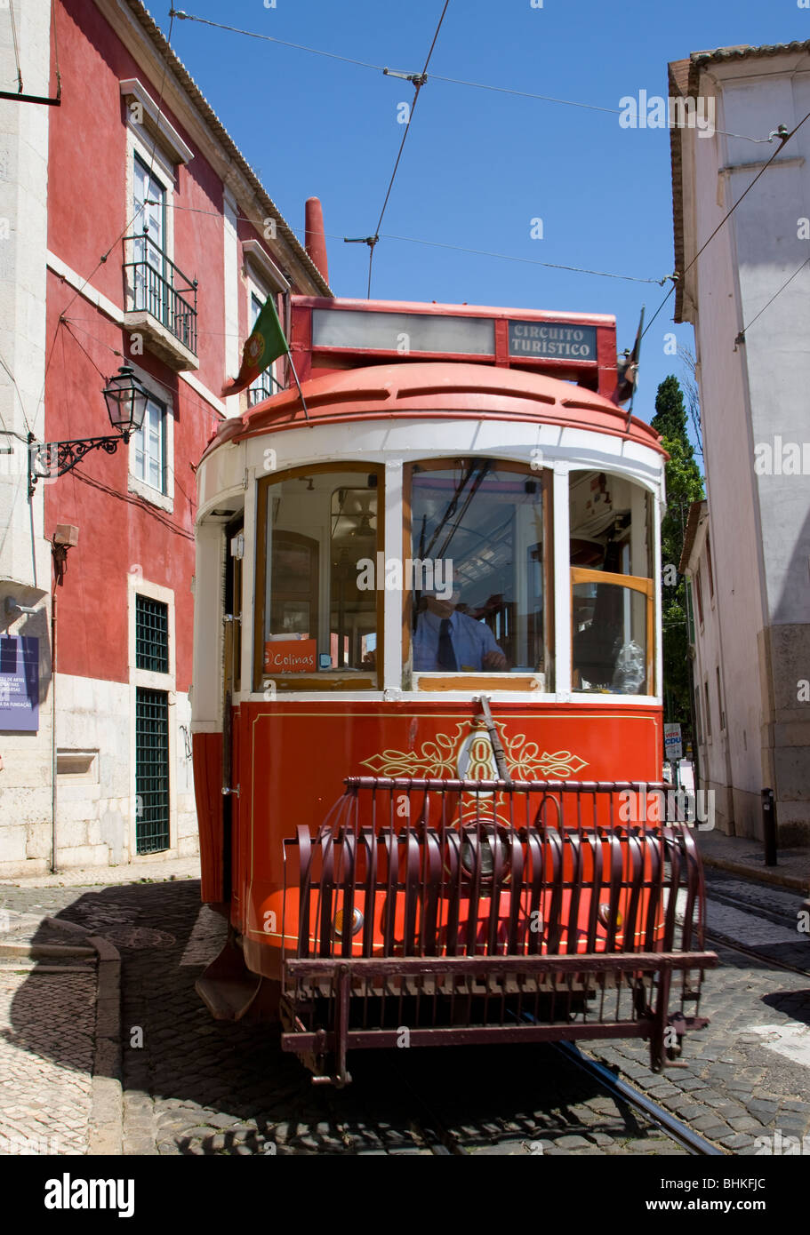 Portugal Lisbon traditional tram in tourist livery in the Alfama district Stock Photo