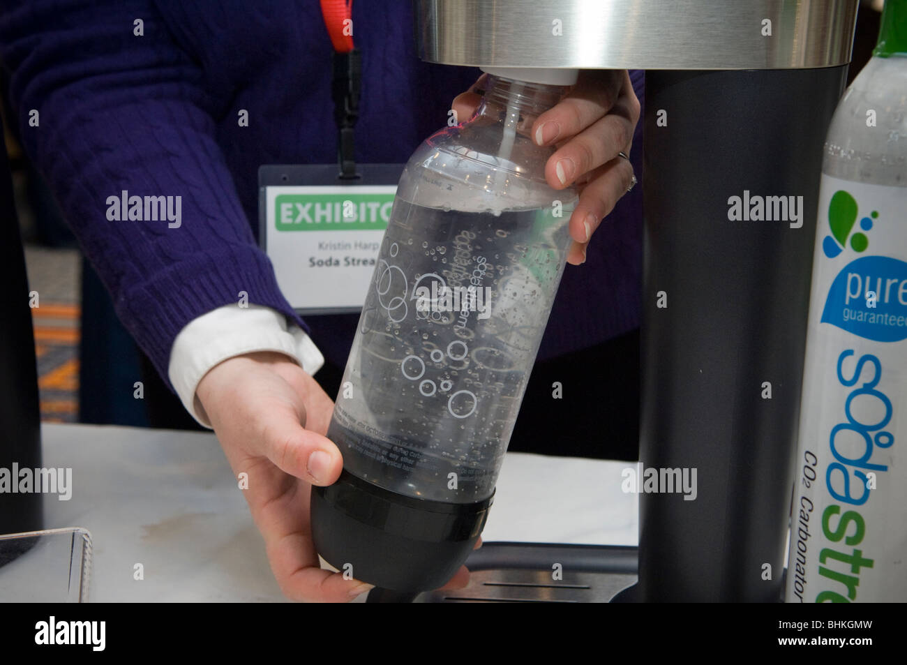 A representative from SodaStream demonstrates their home soda maker at the  2010 Green Products Expo in New York Stock Photo - Alamy