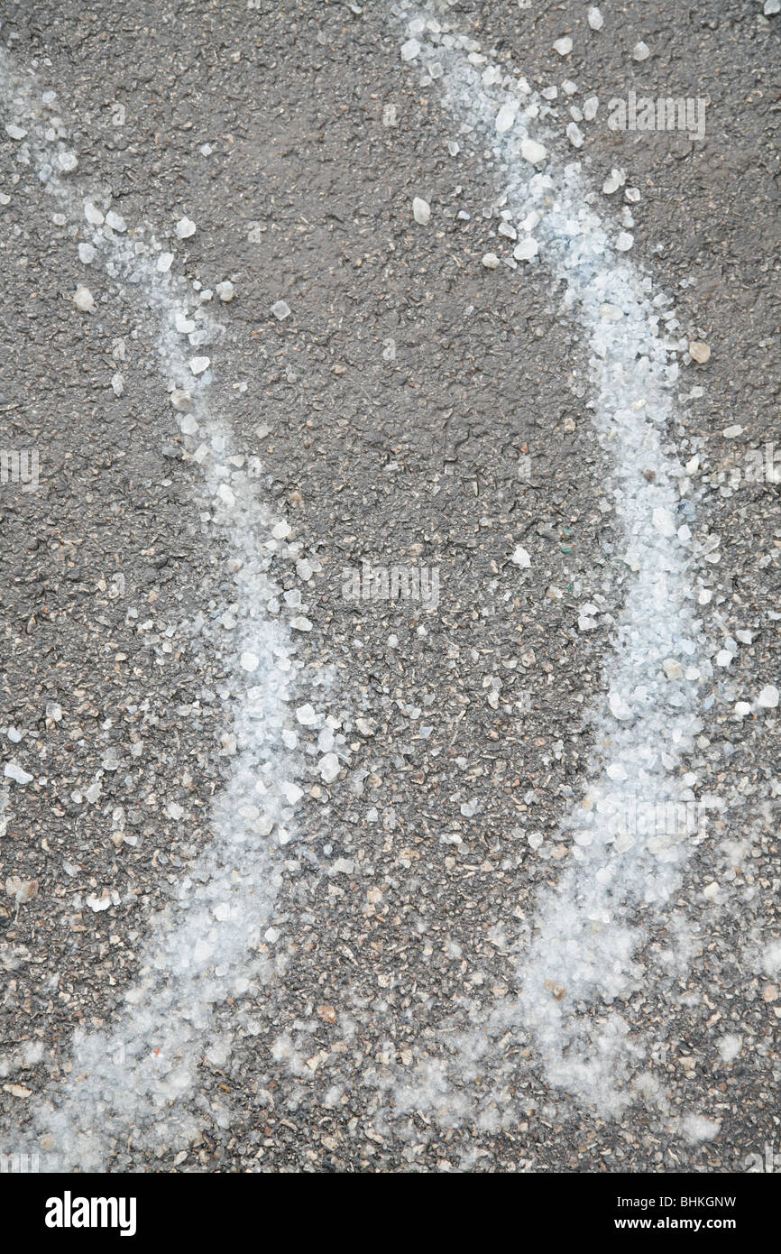 salt on a street to melt ice and snow in winter Stock Photo Alamy