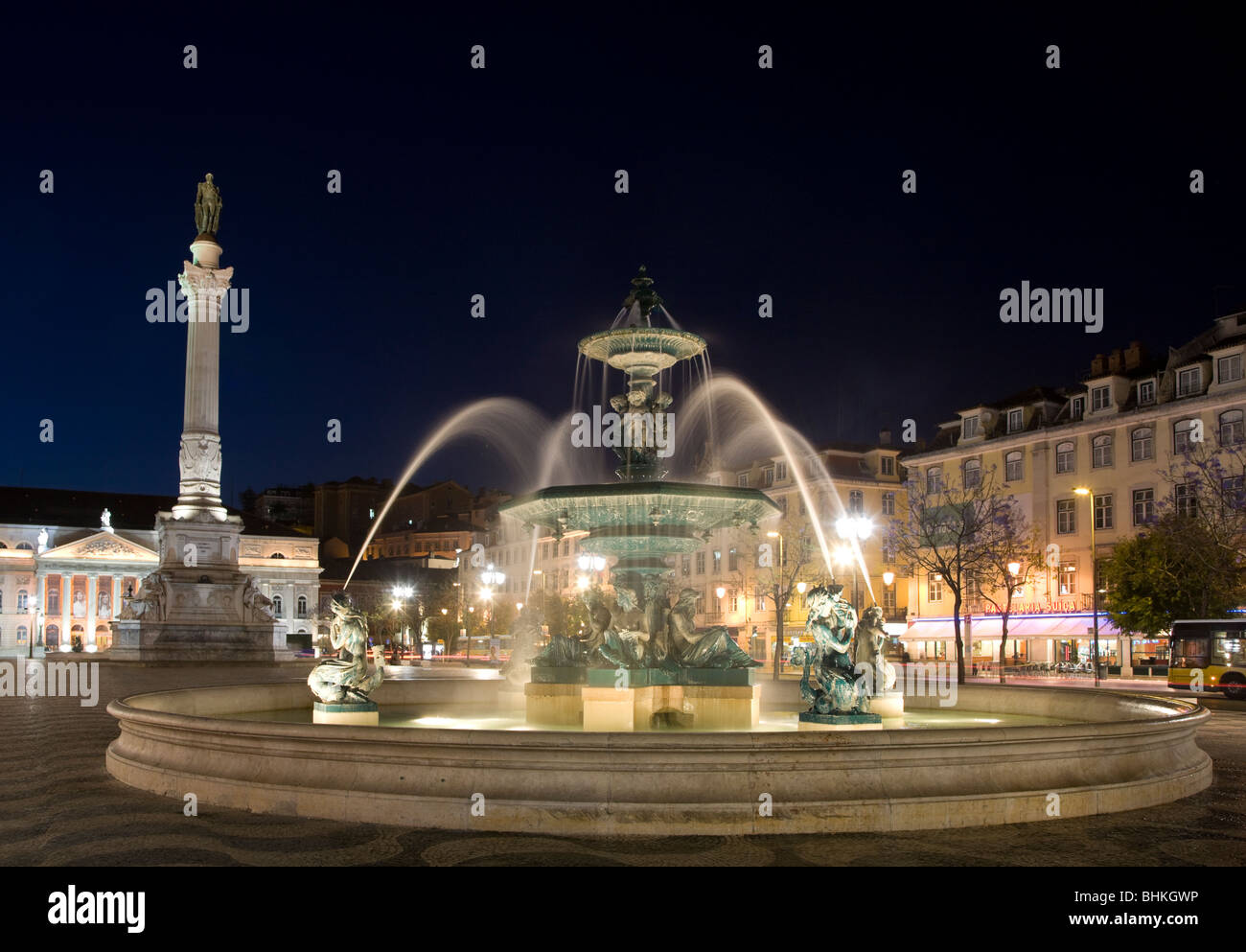 portugal lisbon fountains and statue in Pedro Square illuminated at night Stock Photo